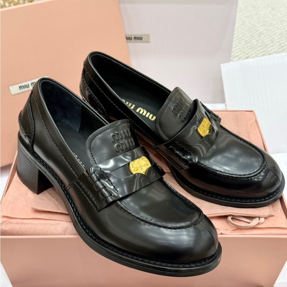 Women's Miu Miu Black Leather Loafers with Gold Accent